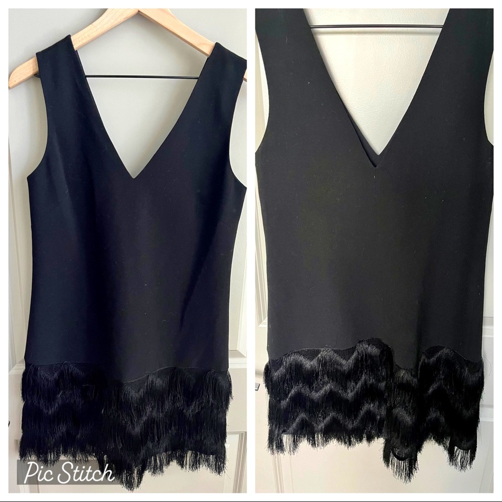 Never been worn black BCBG Maxazria “flapper” style dress! Size 4. Zipper back.